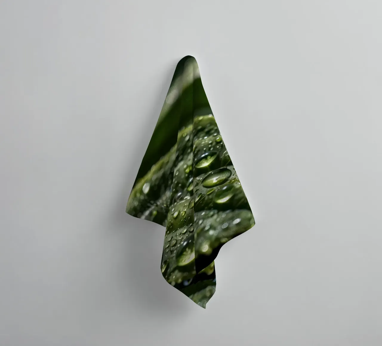 Close-up view of vibrant green leaves covered with dew dropl towel by DesignDoodle