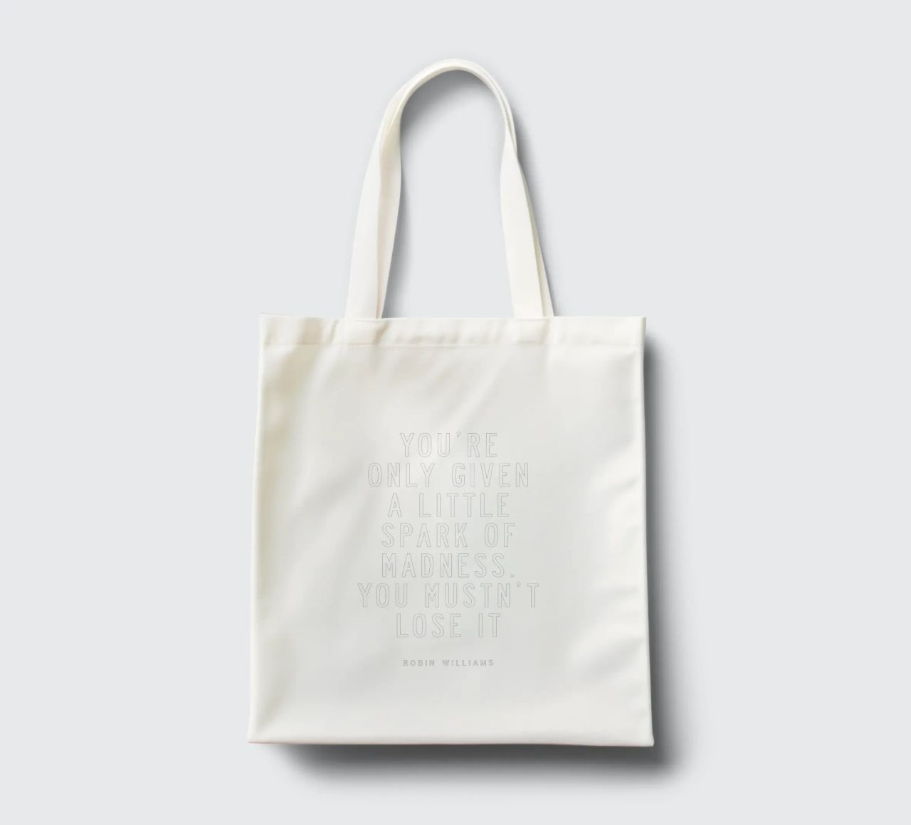 You Are Only Given a Little Spark of Madness Typography tote bag by THE MOTIVATED TYPE