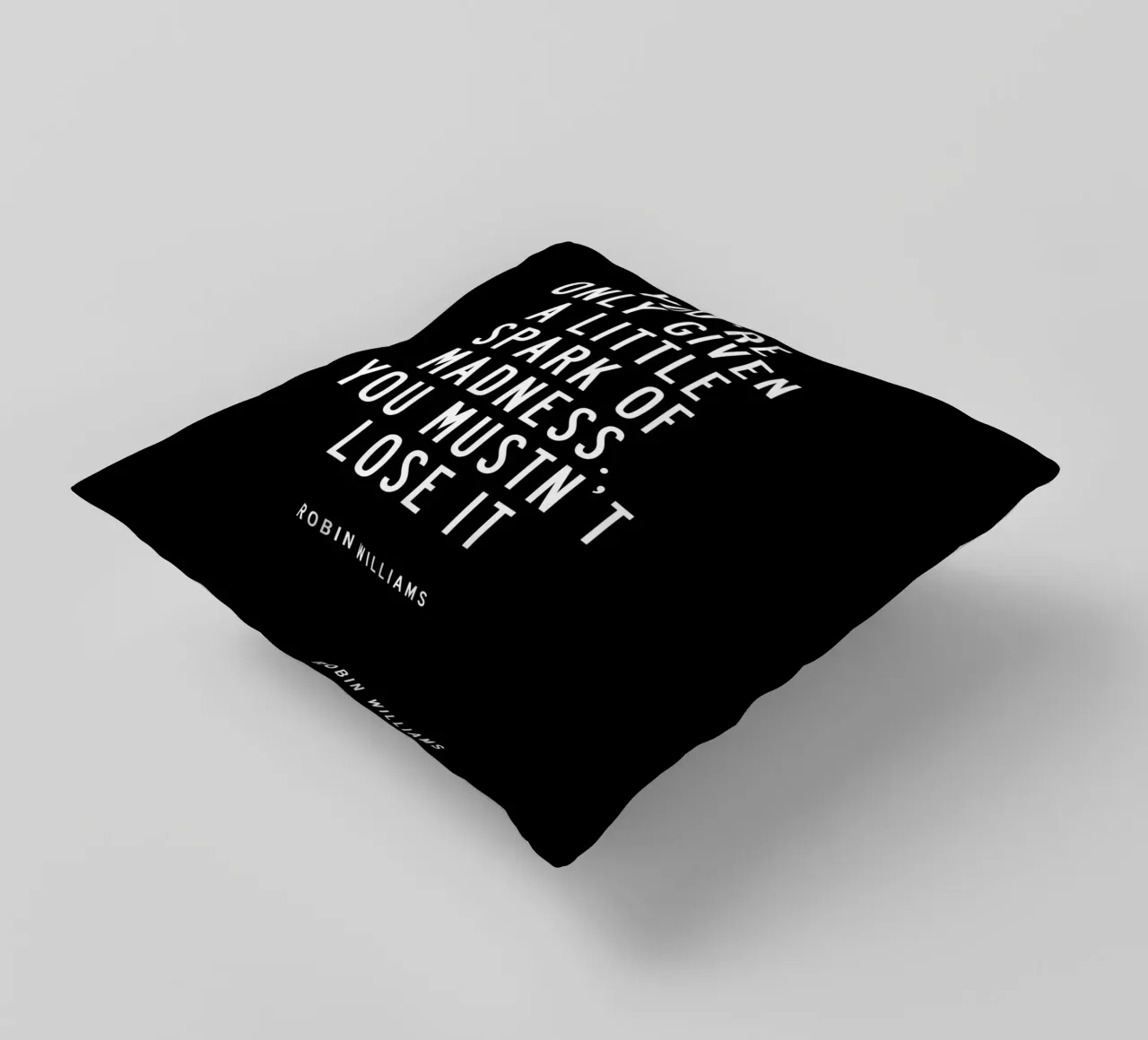 Il ne vous est donné qu'une petite étincelle de folie Typographie coussin de THE MOTIVATED TYPE
