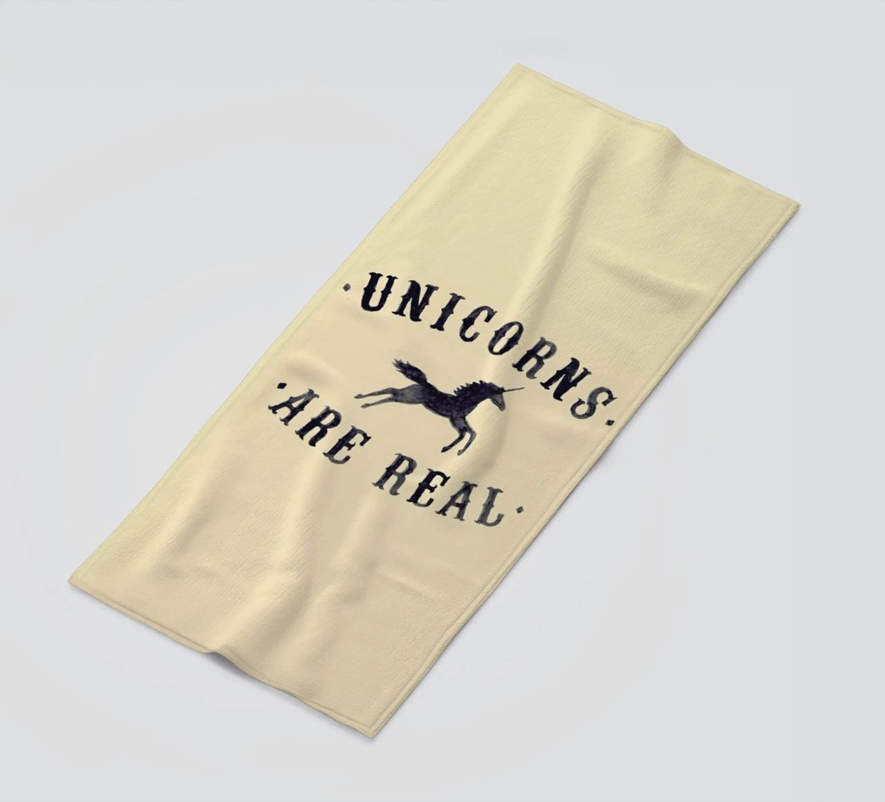 Unicorns Are Real I beach towel by Florent Bodart