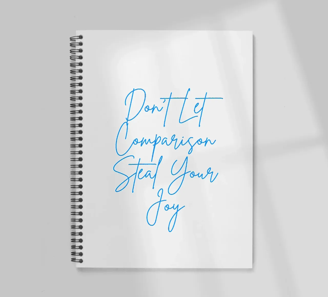 "Don't Let Comparison Steal Your Joy" Blue Text spiral notebook by FABOArt