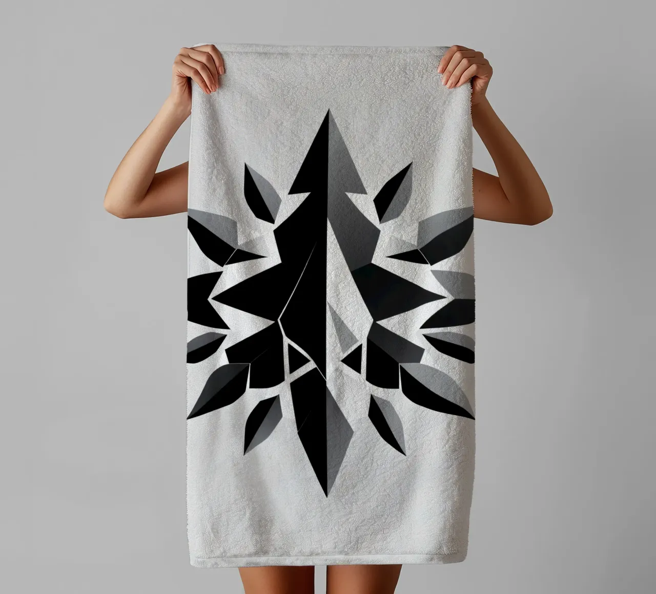 Abstract geometric design of a black and white star shape towel by DesignDoodle