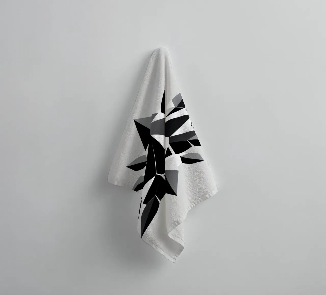 Abstract geometric design of a black and white star shape towel by DesignDoodle