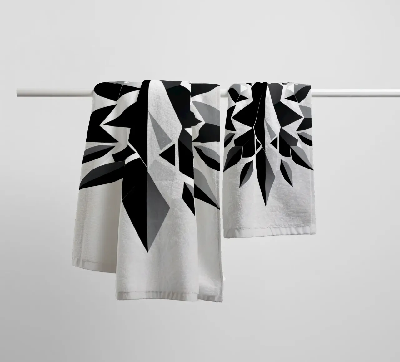 Abstract geometric design of a black and white star shape towel by DesignDoodle