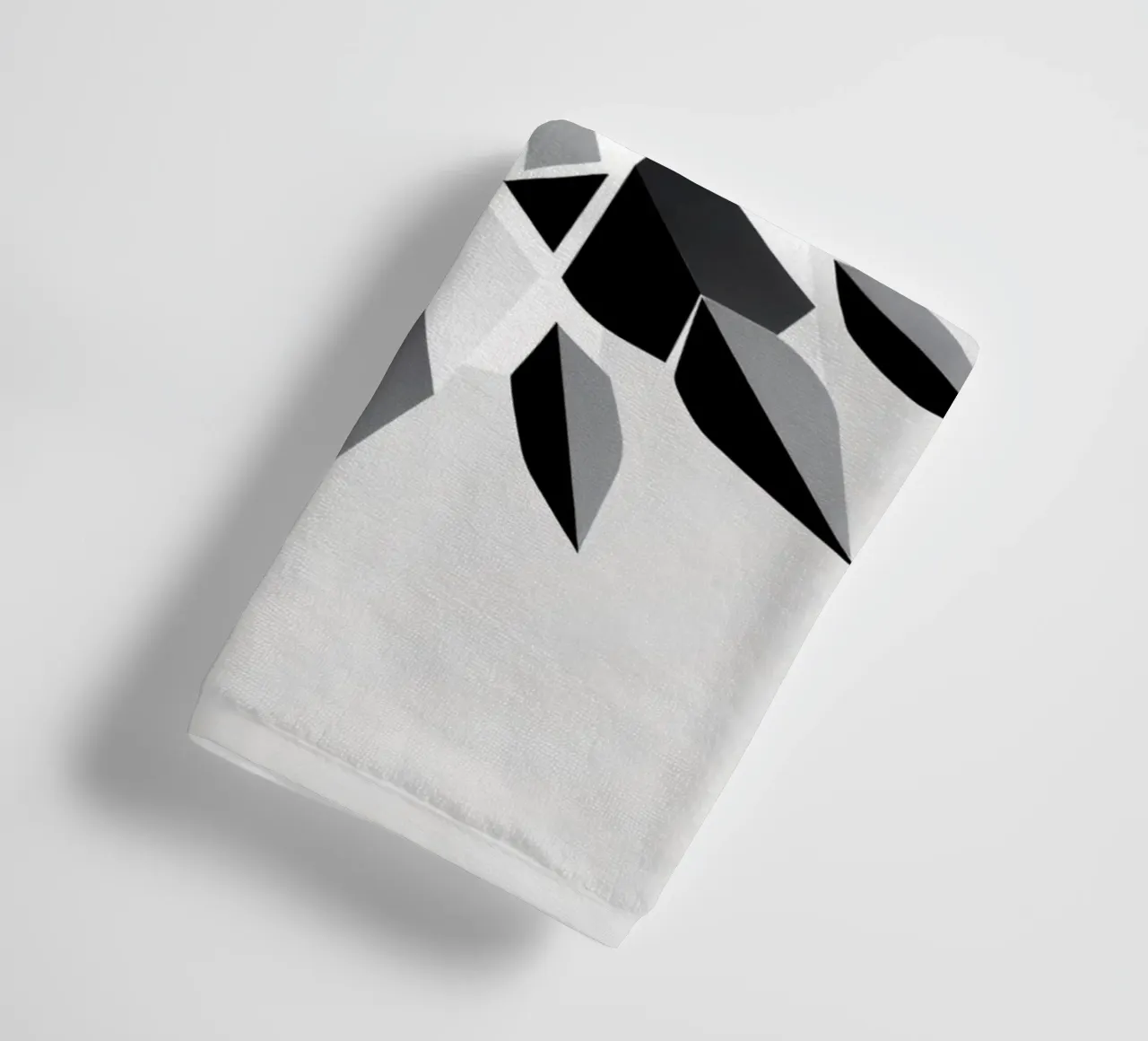 Abstract geometric design of a black and white star shape towel by DesignDoodle