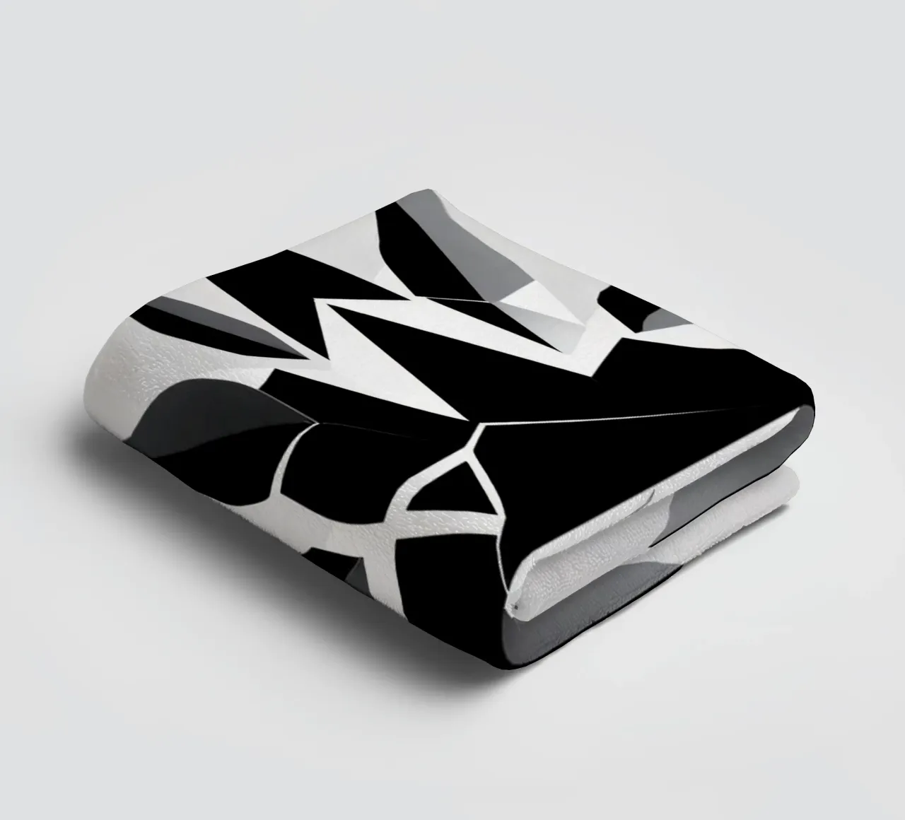 Abstract geometric design of a black and white star shape towel by DesignDoodle