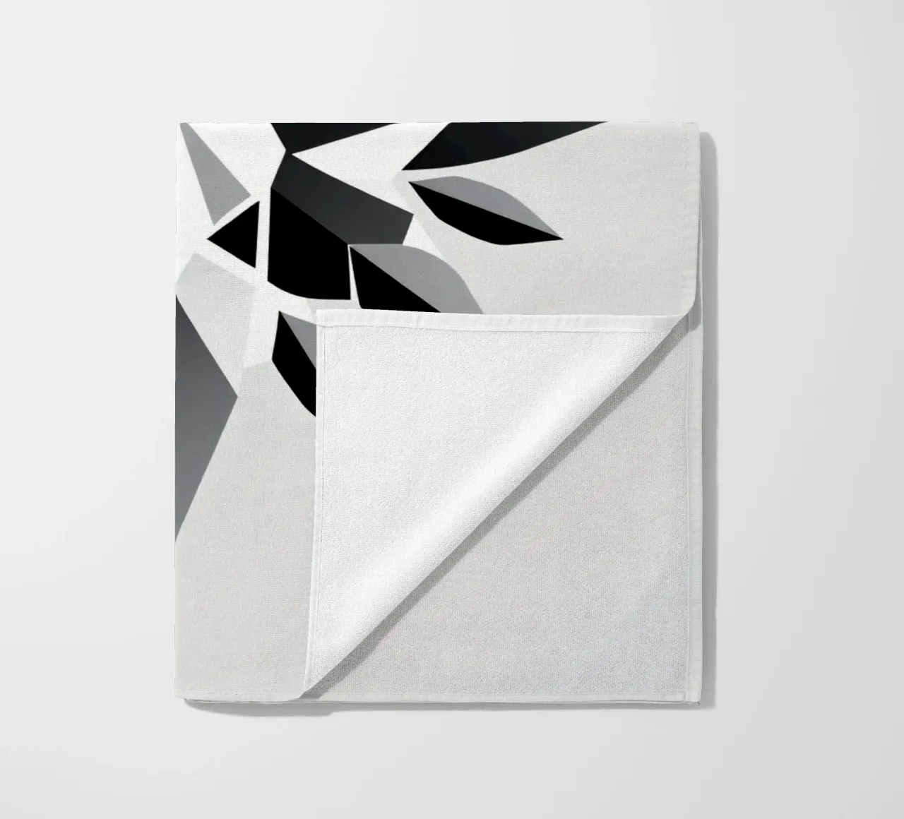 Abstract geometric design of a black and white star shape beach towel by DesignDoodle
