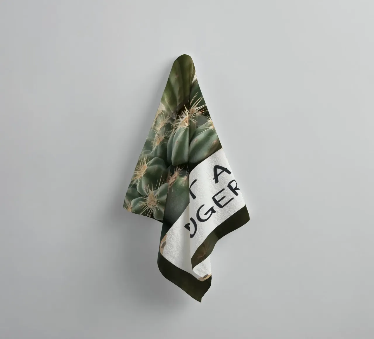 A playful cactus with a humorous sign stands towel by DesignDoodle