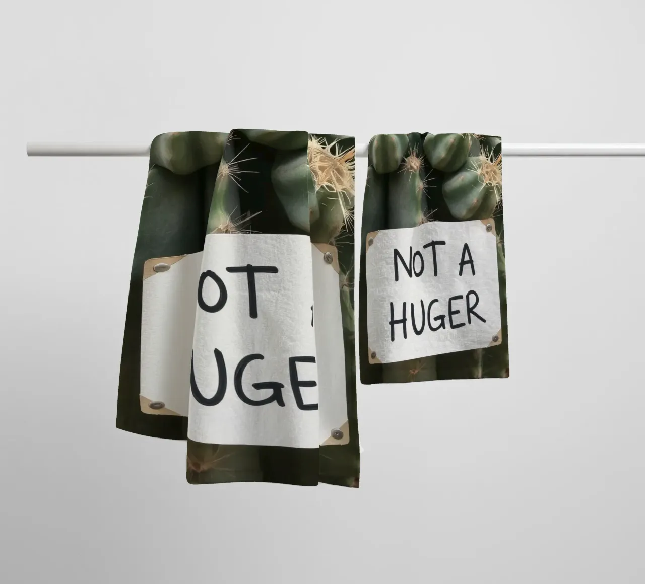 A playful cactus with a humorous sign stands towel by DesignDoodle