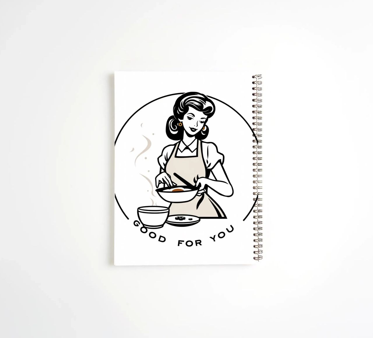 A woman in an apron prepares a meal while smiling spiral notebook by DesignDoodle