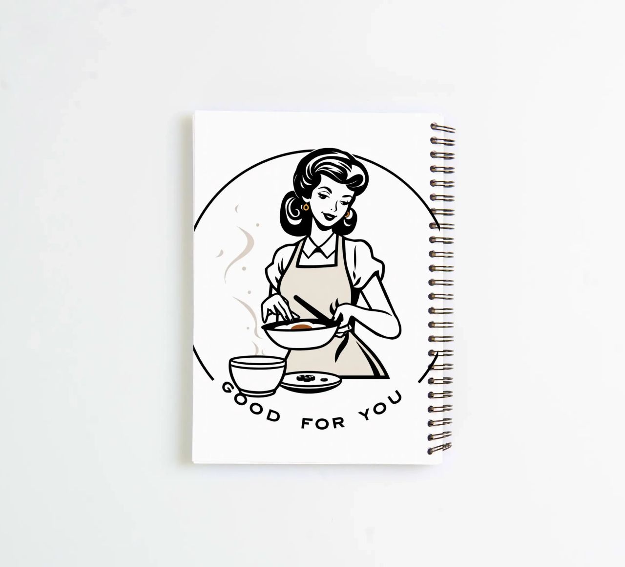 A woman in an apron prepares a meal while smiling spiral notebook by DesignDoodle