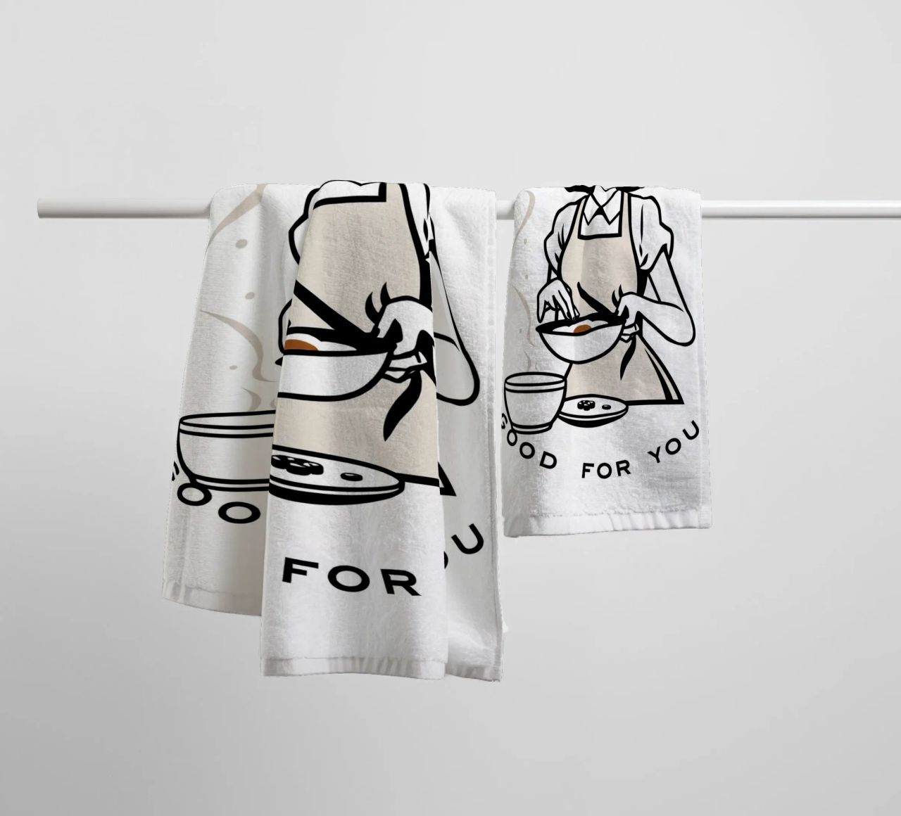 A woman in an apron prepares a meal while smiling towel by DesignDoodle
