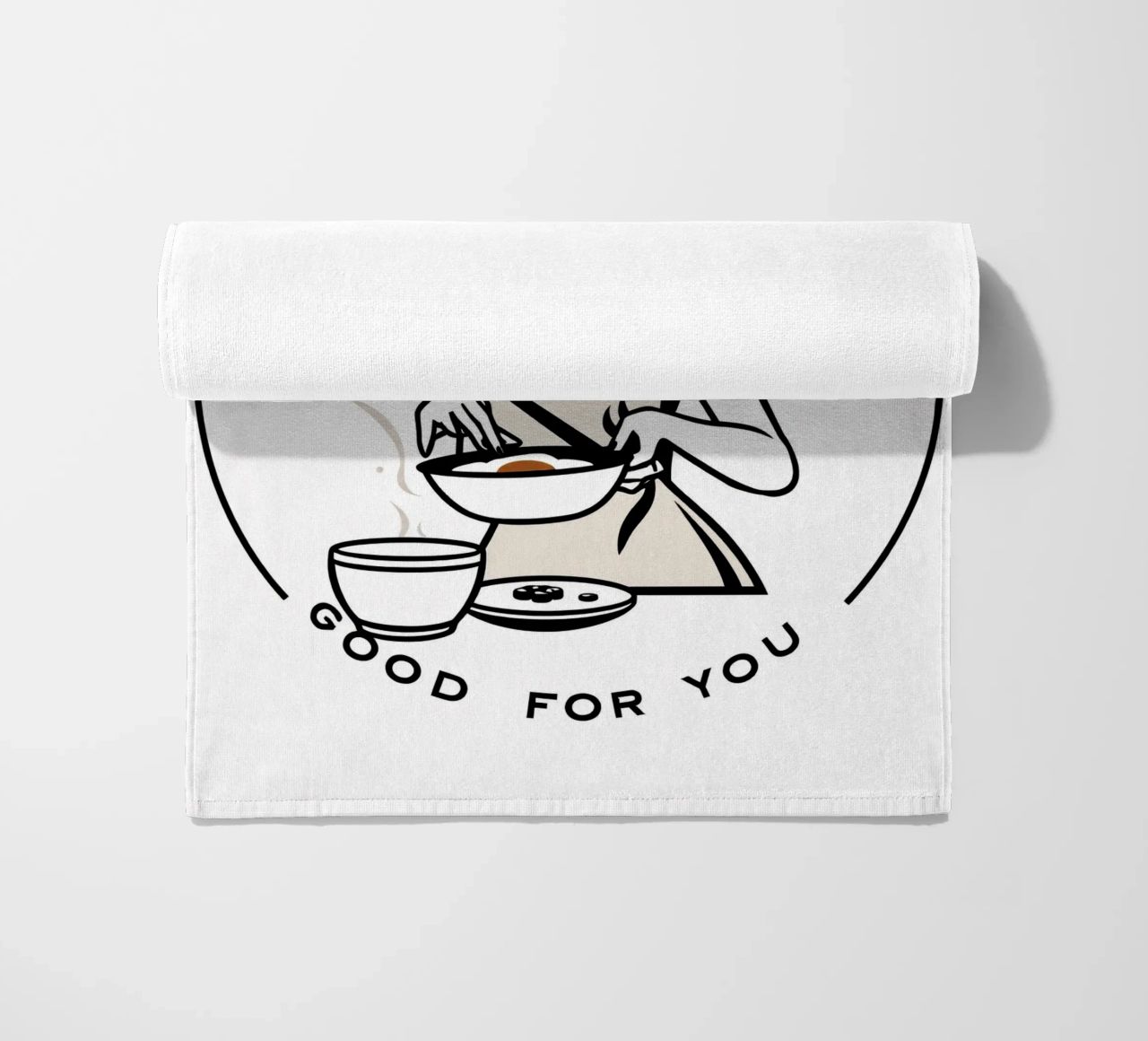 A woman in an apron prepares a meal while smiling beach towel by DesignDoodle