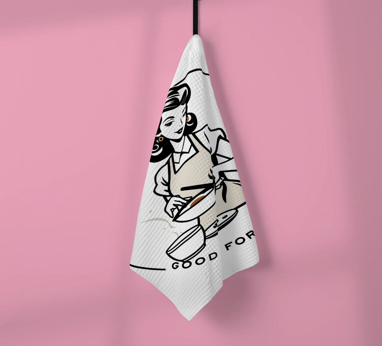 A woman in an apron prepares a meal while smiling tea towel by DesignDoodle