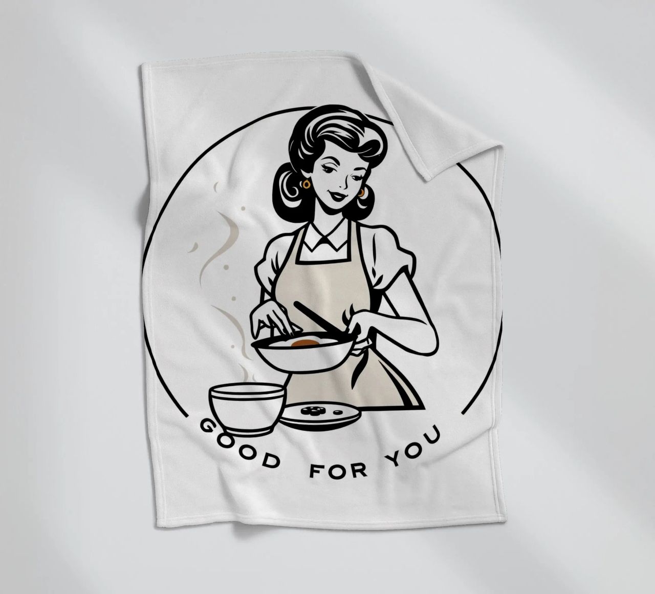 A woman in an apron prepares a meal while smiling fleece blanket by DesignDoodle