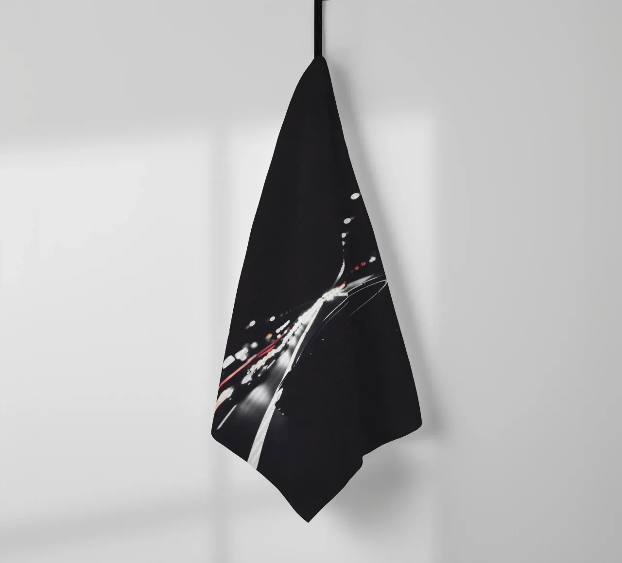 Nighttime city highway with moving vehicles illuminated tea towel by DesignDoodle