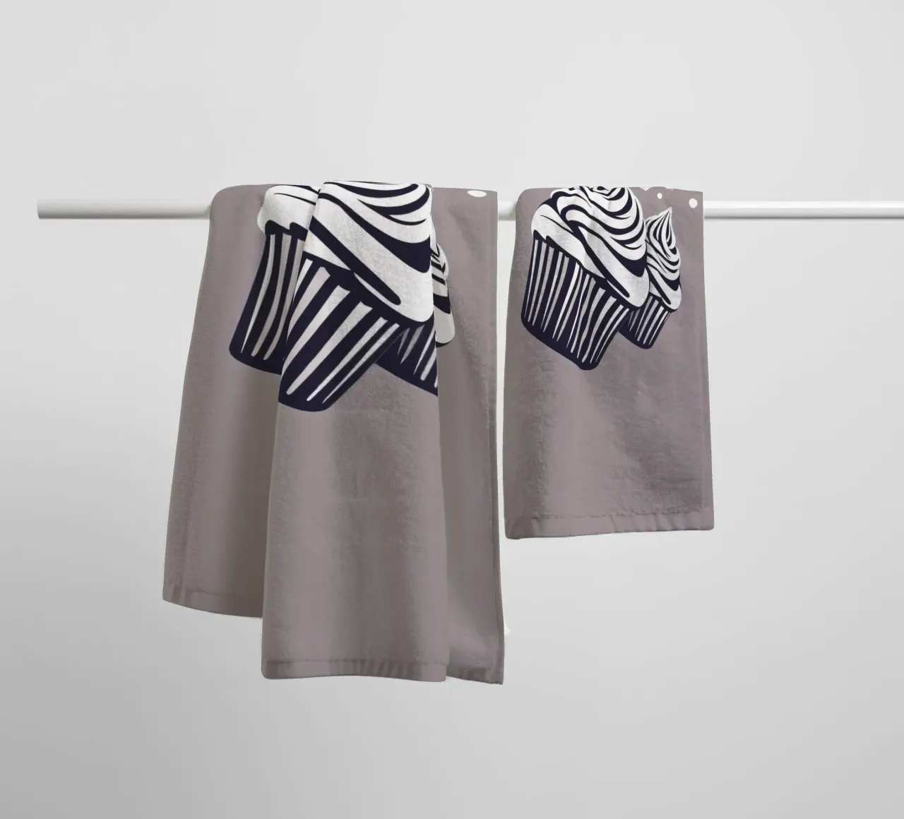 Two elegantly designed cupcakes with swirled frosting towel by DesignDoodle
