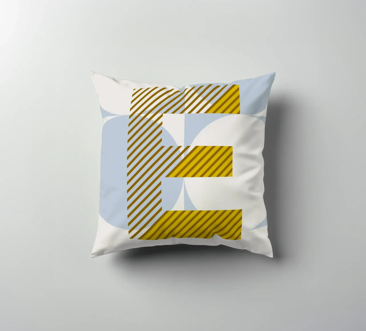 E Typeface Alphabet decorative cushion by lazydaypaper