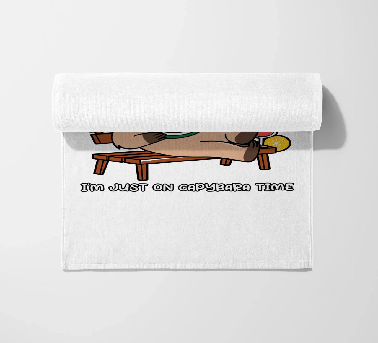 I'M NOT LAZY. I'M JUST ON CAPYBARA TIME beach towel by edsonramosart