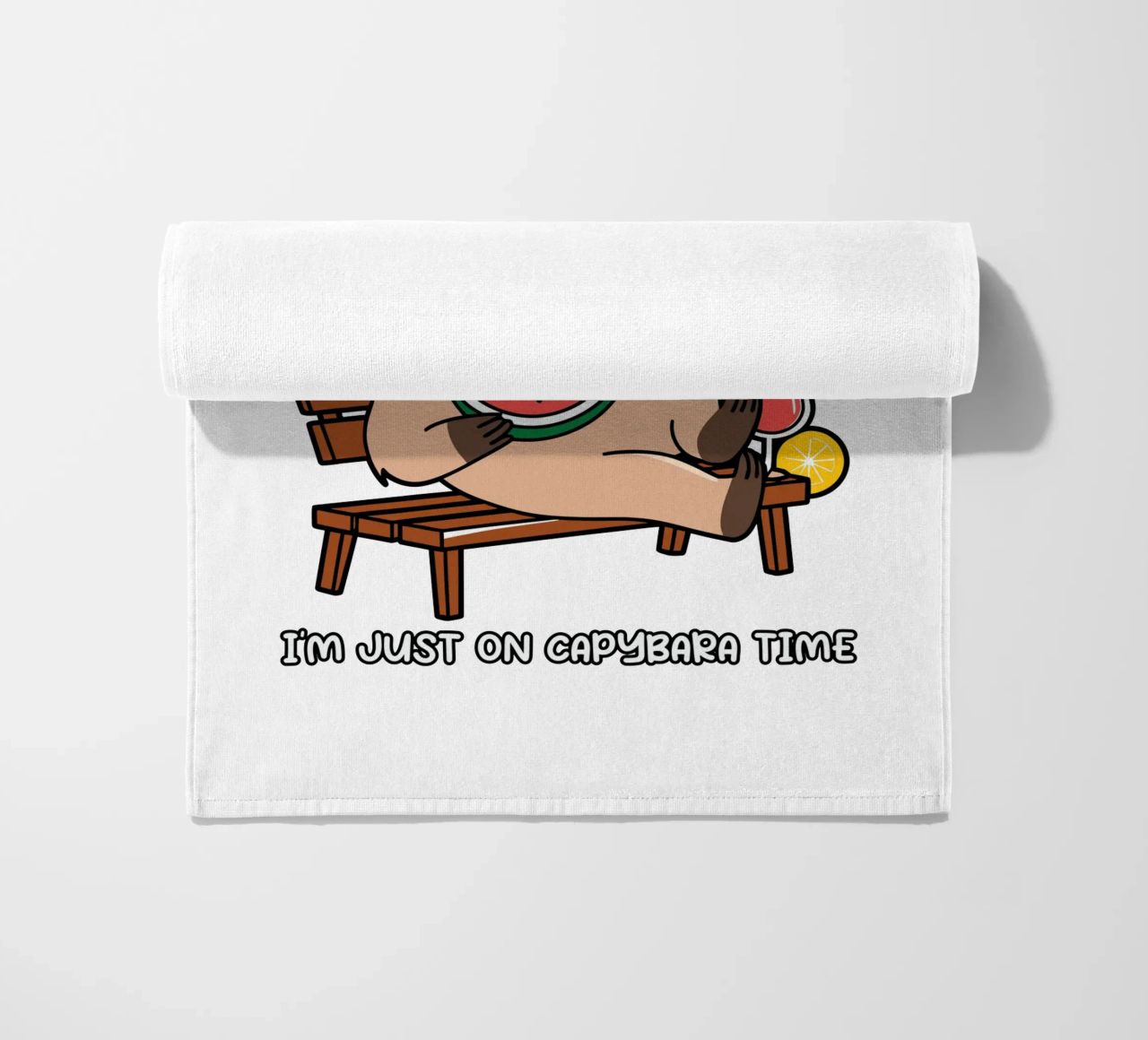 I'M NOT LAZY. I'M JUST ON CAPYBARA TIME beach towel by edsonramosart