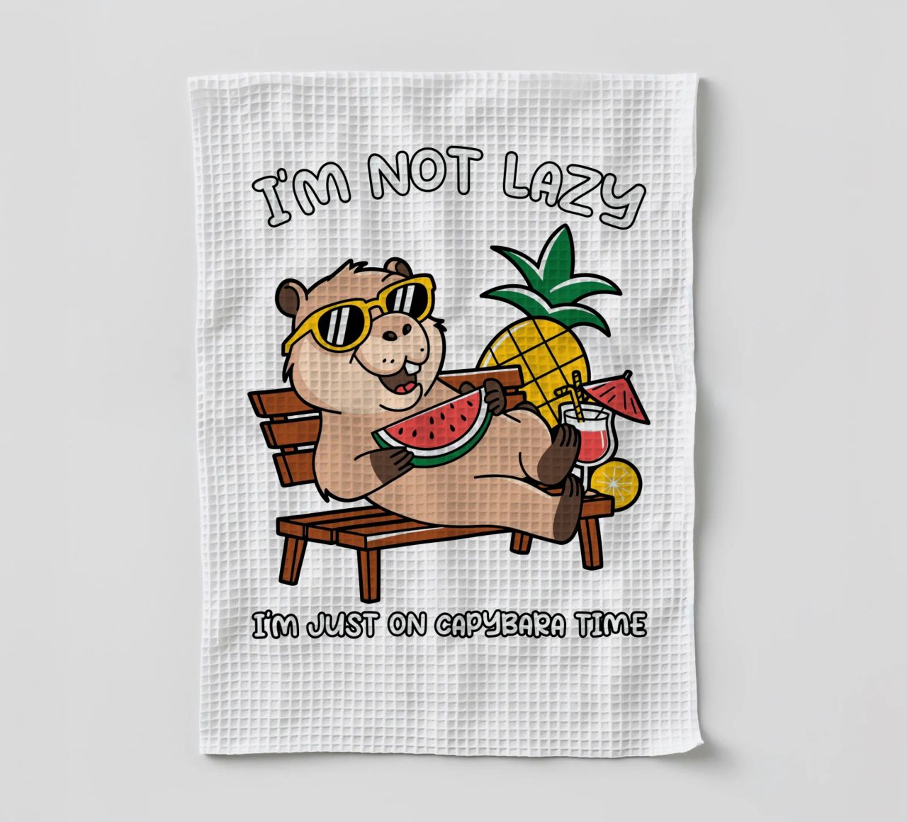 I'M NOT LAZY. I'M JUST ON CAPYBARA TIME tea towel by edsonramosart