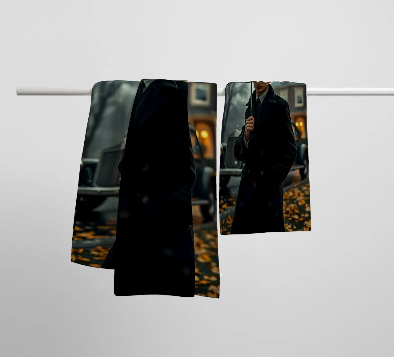 Un giovane uomo si trova sotto un ombrello nero in un autunno piovoso. asciugamano da bagno da DesignDoodle