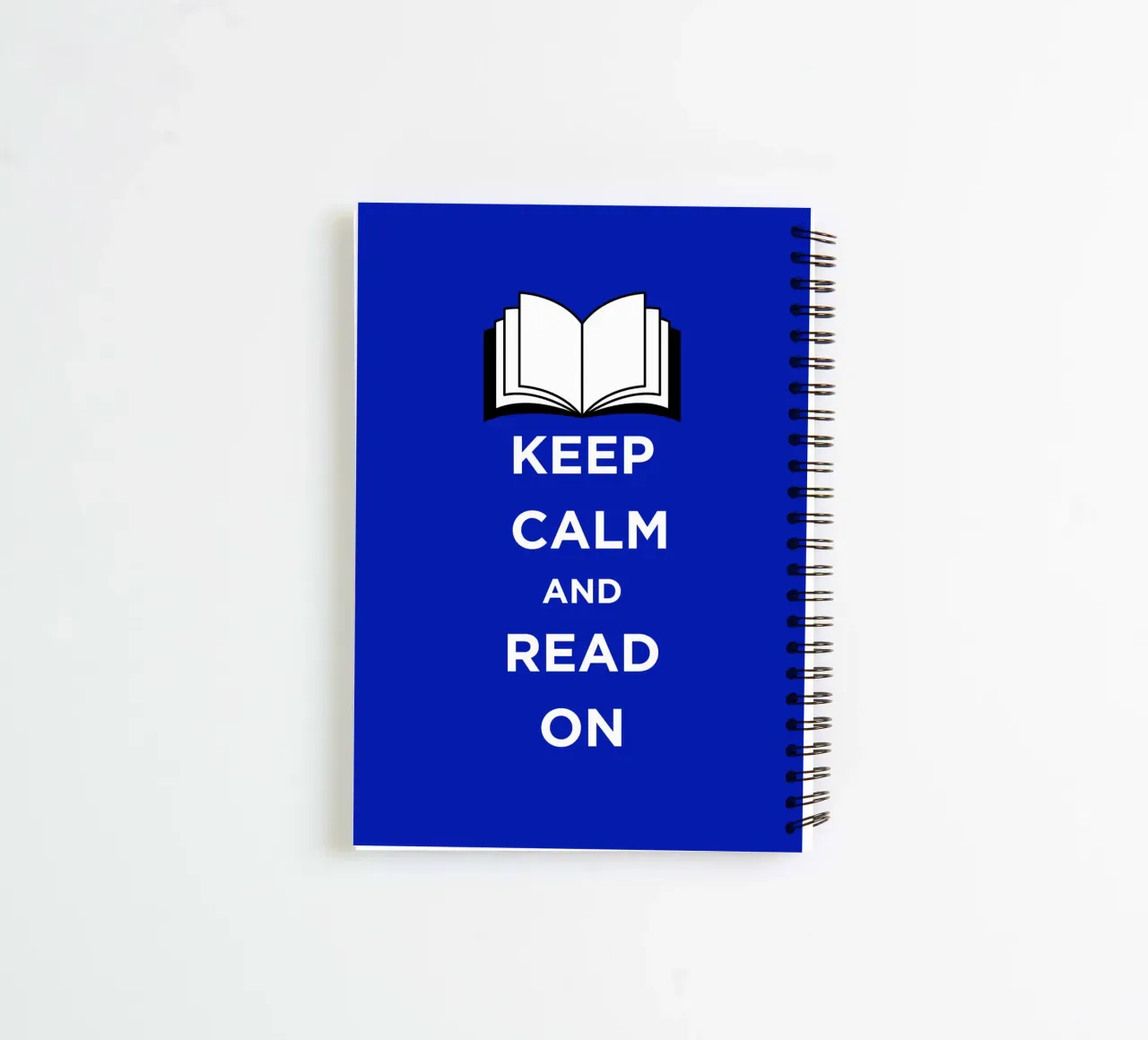 Keep Calm and Read On - Blue Background spiral notebook by FABOArt