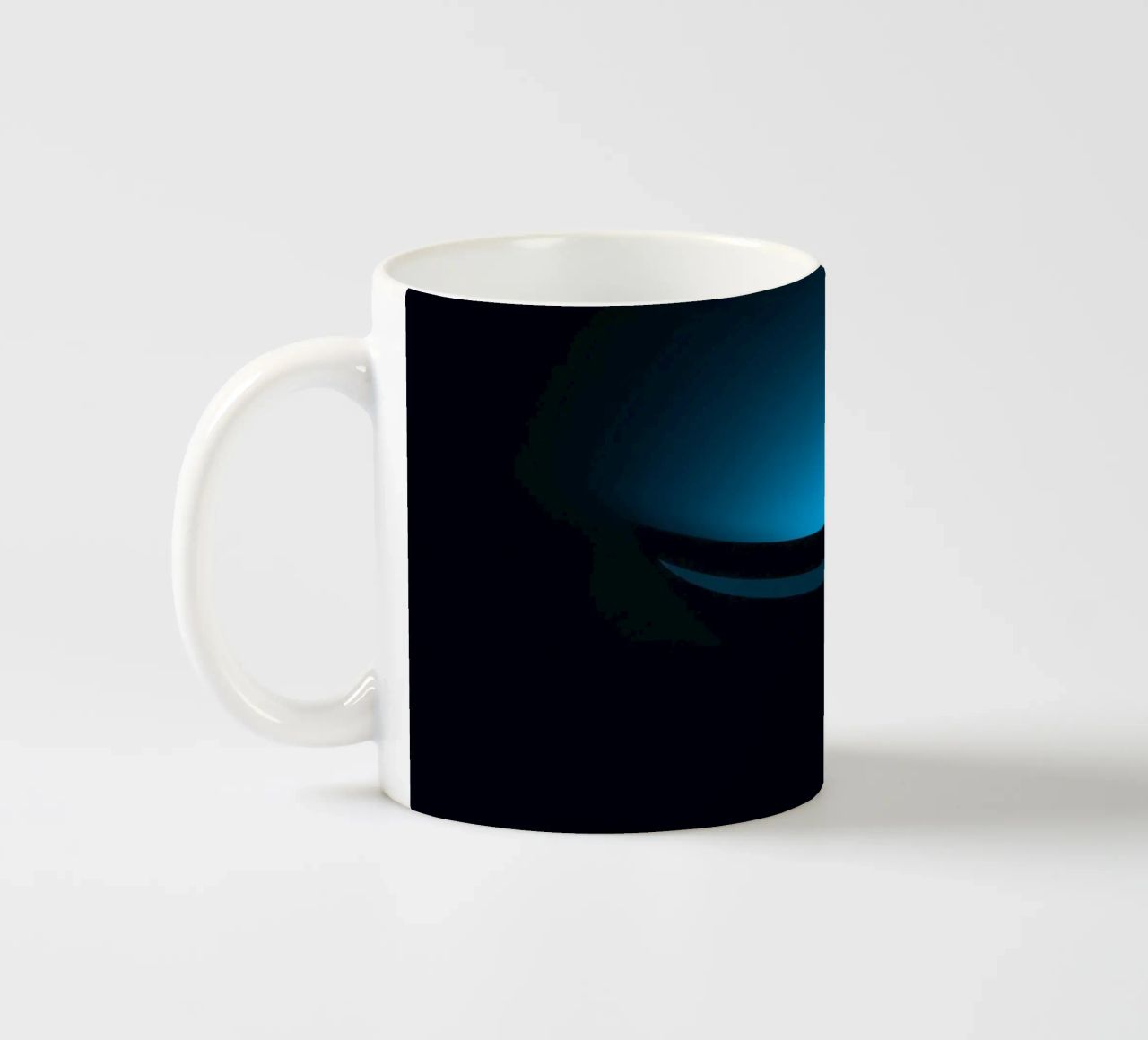 Subtle blue glow illuminating a curved surface in a dark set ceramic mug by DesignDoodle