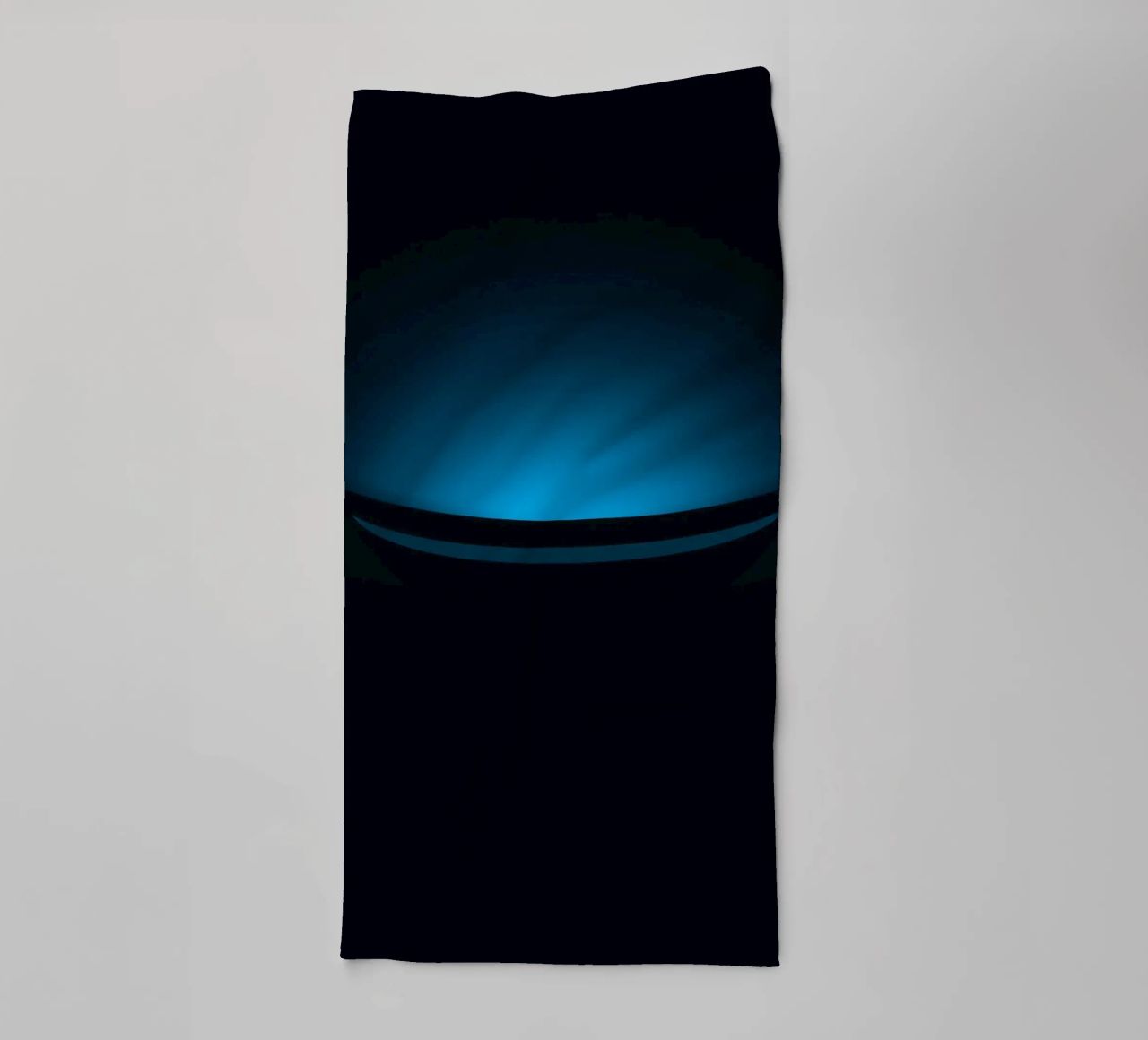 Subtle blue glow illuminating a curved surface in a dark set towel by DesignDoodle