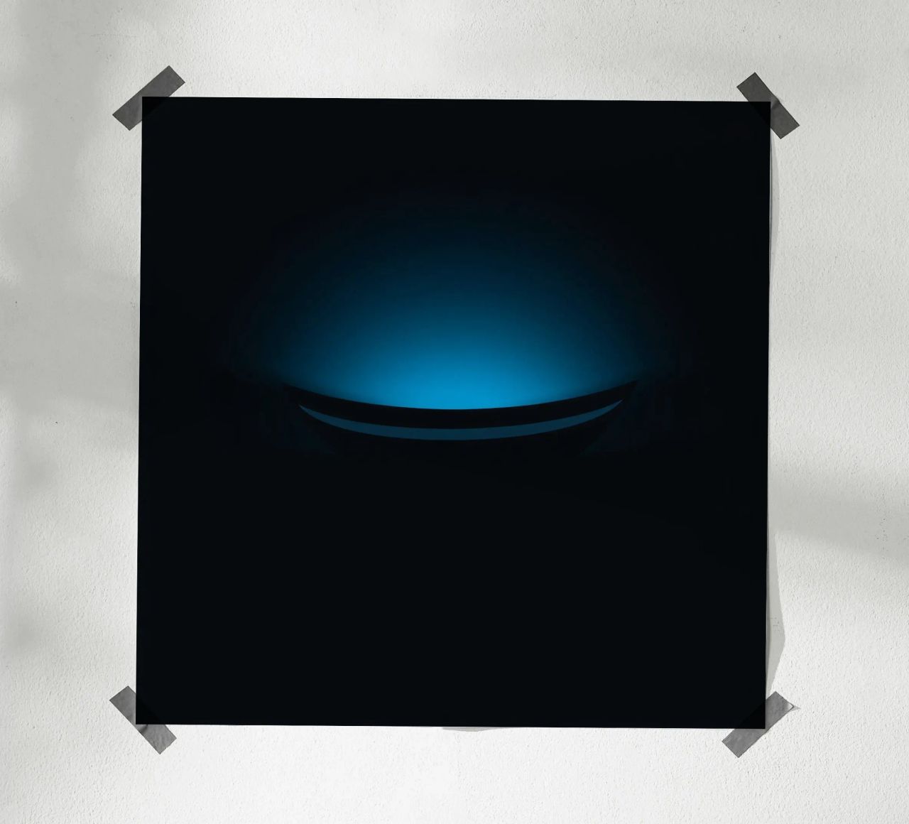Subtle blue glow illuminating a curved surface in a dark set poster by DesignDoodle
