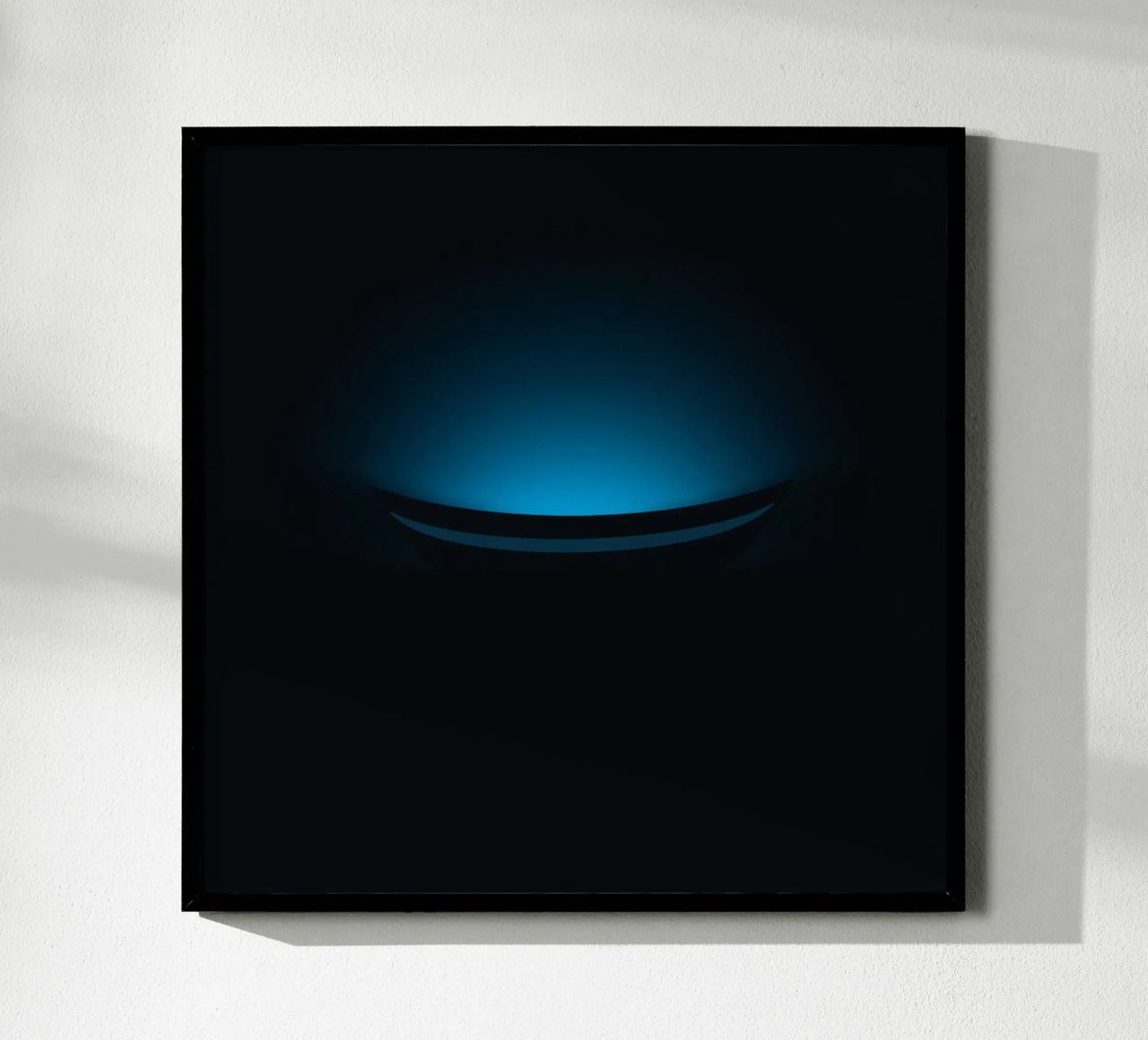 Subtle blue glow illuminating a curved surface in a dark set poster by DesignDoodle