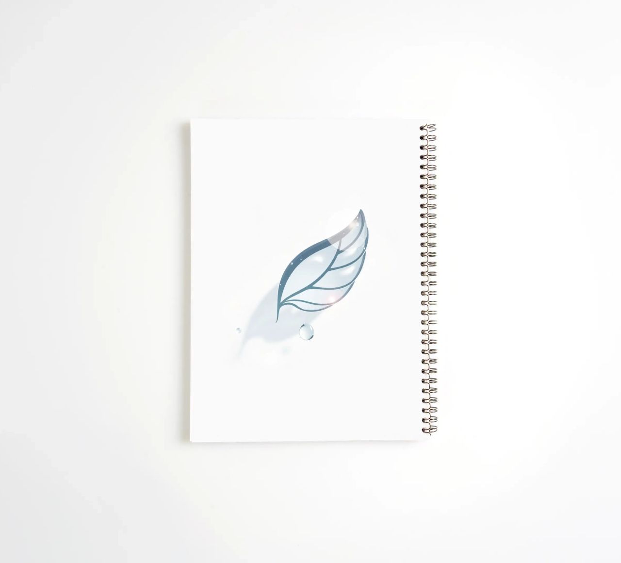 Elegant water droplet resting on a delicate leaf design agai spiral notebook by DesignDoodle