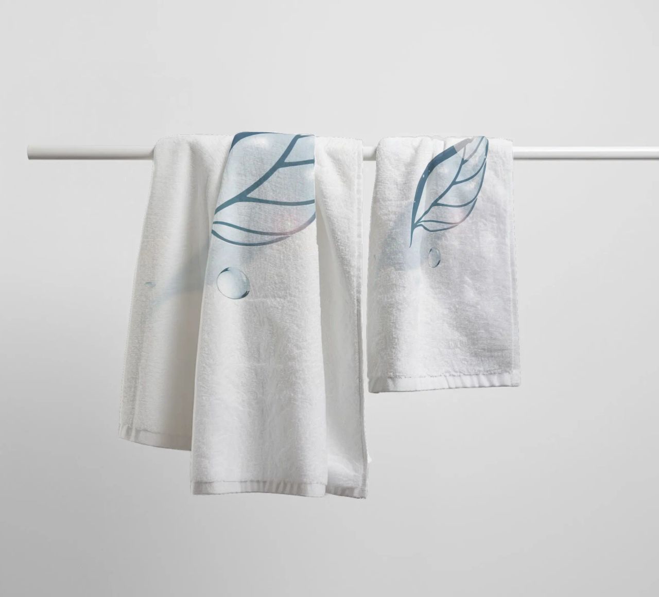 Elegant water droplet resting on a delicate leaf design agai towel by DesignDoodle