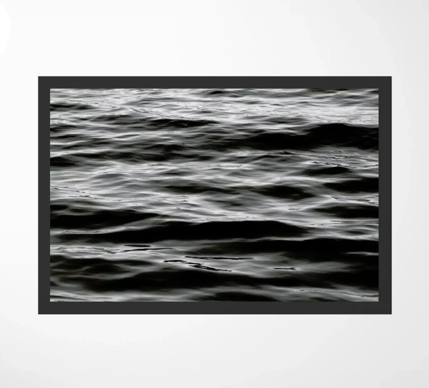 Black Ocean doormat by Studio Nahili