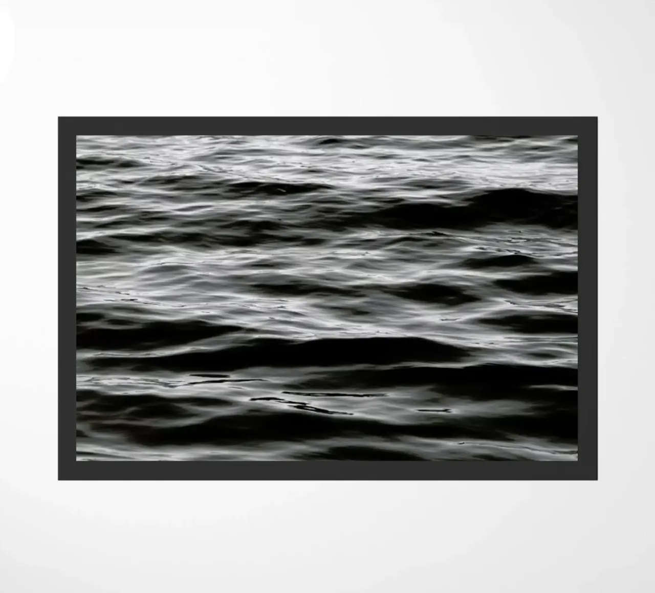 Black Ocean doormat by Studio Nahili